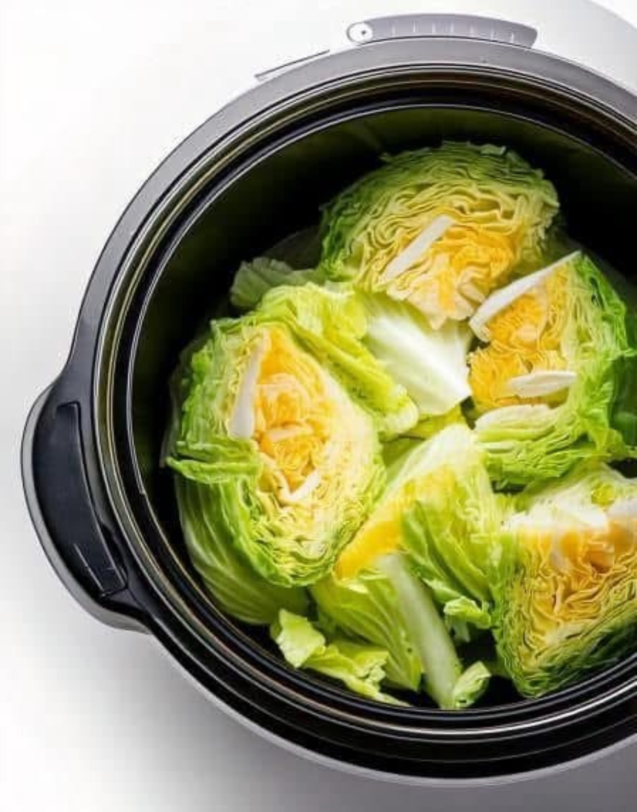 Put raw cabbage wedges in a slow cooker with these 3 ingredients