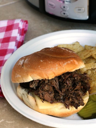 Tender shredded beef coated in savory slow cooker juices and onions