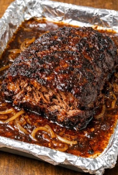 Tender poor man brisket served with softened onions and dark cooking juices