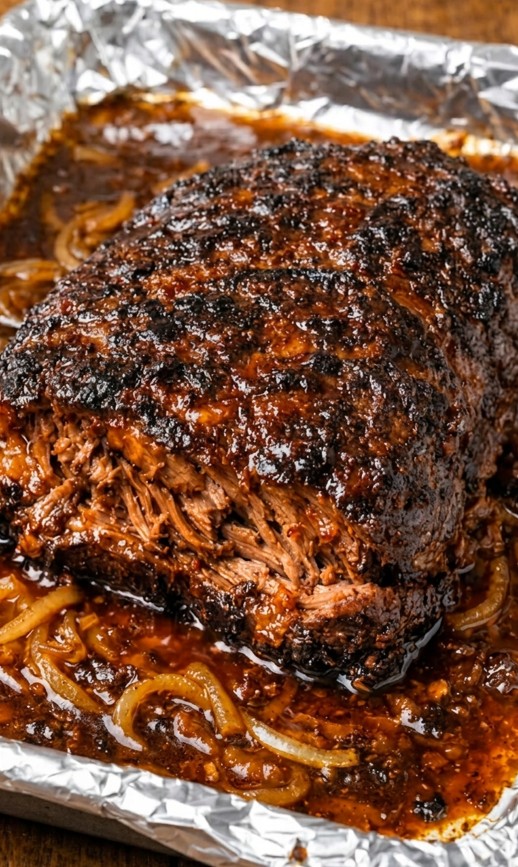 Poor man brisket with tender chuck roast caramelized onions and BBQ cooking juices