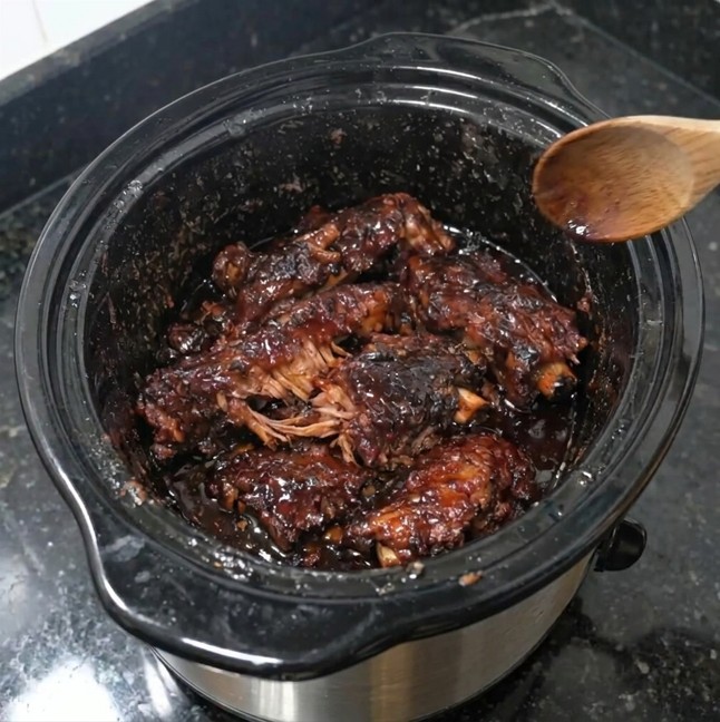 Slow cooker short ribs coated in thick sticky barbecue glaze