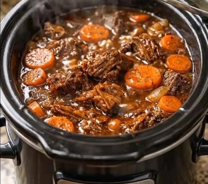 Tender slow-cooked beef pot roast with carrots and savory gravy